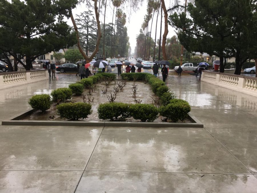 Van Nuys teachers stand their ground striking in front of the school in the rain.