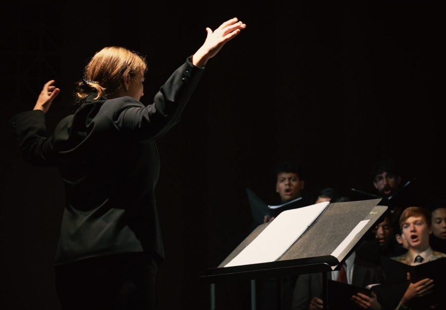 Brianne Arevalo conducts her vocalists.