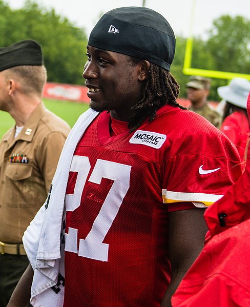 Missouri Gov. Michael Parson (left) talks with Kareem Hunt, a member of the Kansas City Chiefs football team, at the Chief’s training camp in St. Joseph, Mo., Aug. 14, 2018. The Chiefs hosted a military appreciation day on their final day of training. (U.S. Air National Guard photo by Master Sgt. Michael Crane)