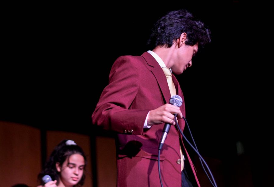 As the sun comes down the moon comes up, Enrique Berganza, preps his mic and gets ready for the Fall concert at Van Nuys High School on Oct. 18, 2019.