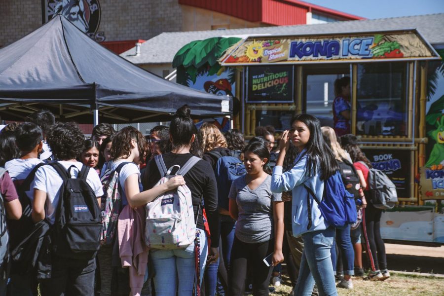 As the day goes by a shaved ice truck proved by, Kona Ice, the freshmens come rushing in to get shaved ice on a very hot day at Freshmen Funday on Oct. 18, 2019. 
