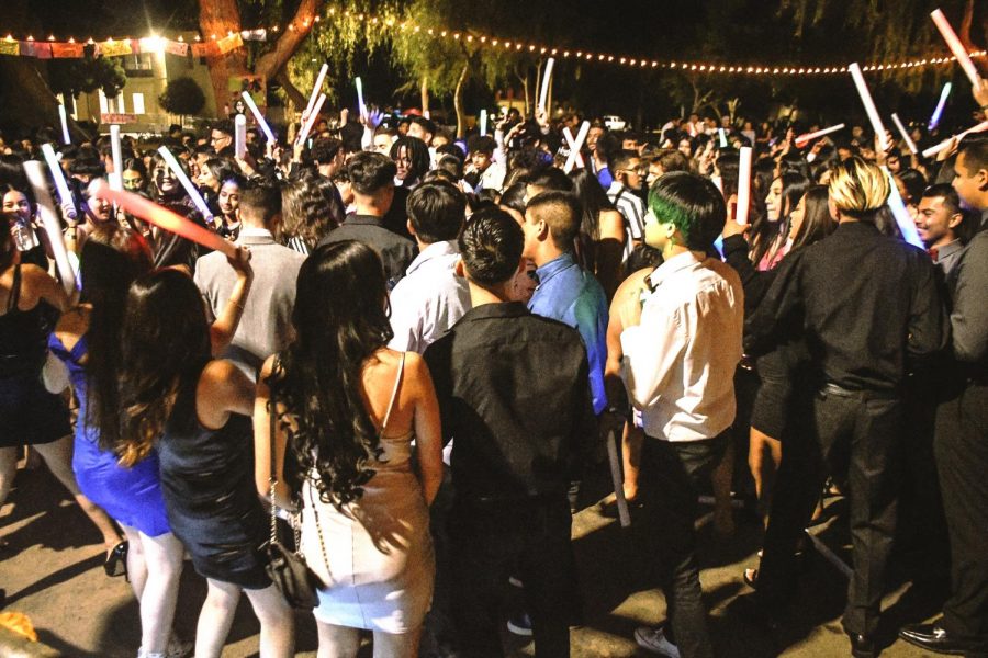 Students partying together in a tight hundle during the last homecoming dance hosted at school pre-pandemic on Nov. 2, 2019. 