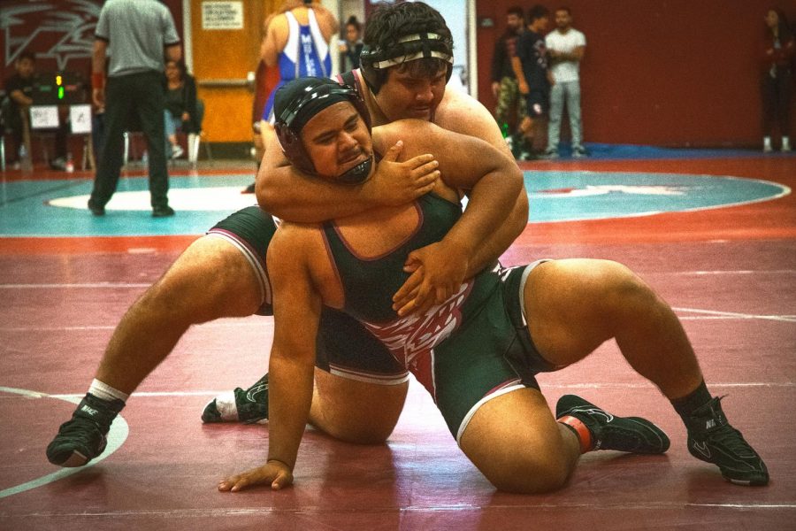 During the King of the City Wrestling Tournament hosted by Van Nuys High School on Nov. 23, 2019, Carlos Cruz (foreground) escapes from Jesus Rios Ochoa in the first period. 