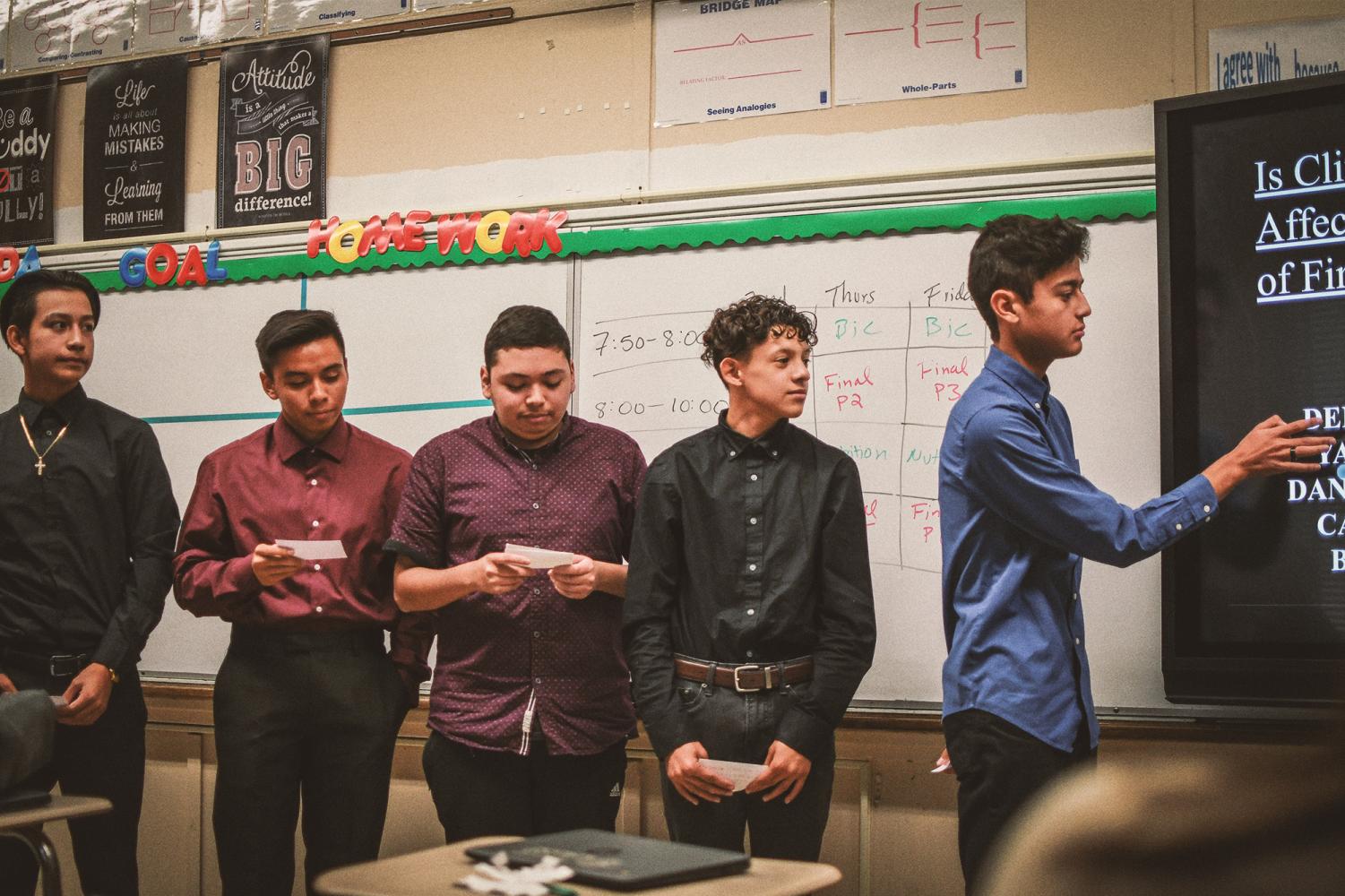 Students promote donations to charities in 10th grade English class