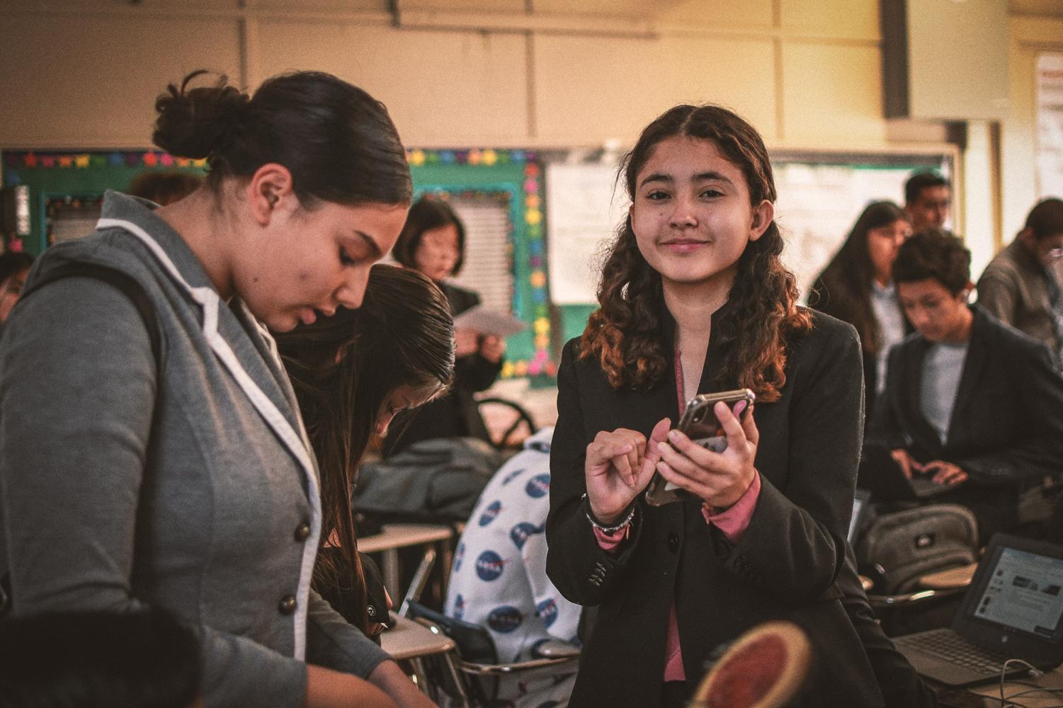 Students promote donations to charities in 10th grade English class