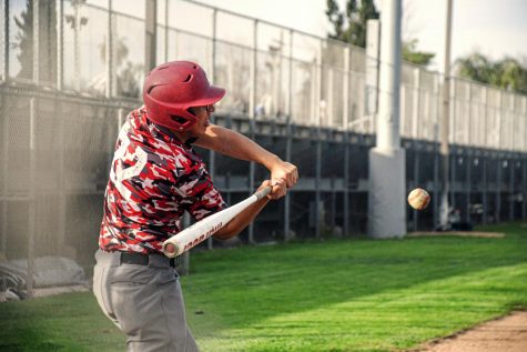 Ready to bat, co-team captain Anthony Islas steps up to the plate.