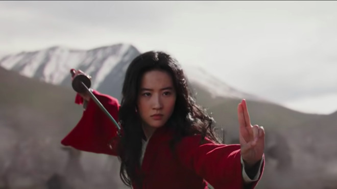 Mulan in a pose, wielding a sword, preparing for battle.