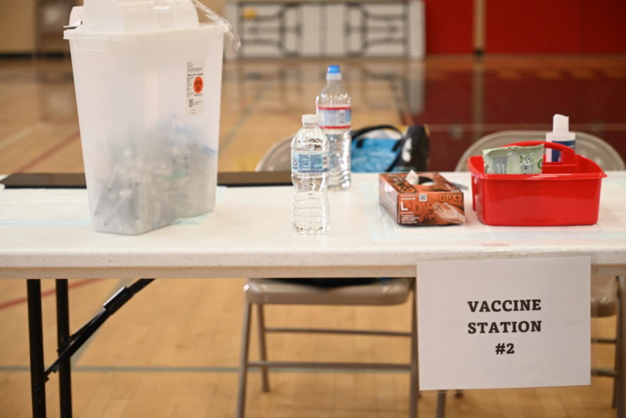 Vaccination stations set up in the small gym allow for students and adults to get vaccinated safely. 