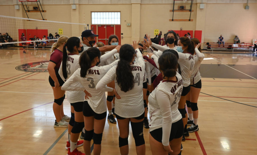 3, 2, 1 GO WOLVES! All hands in for Girls volleyball as they prepare to start their next set. 