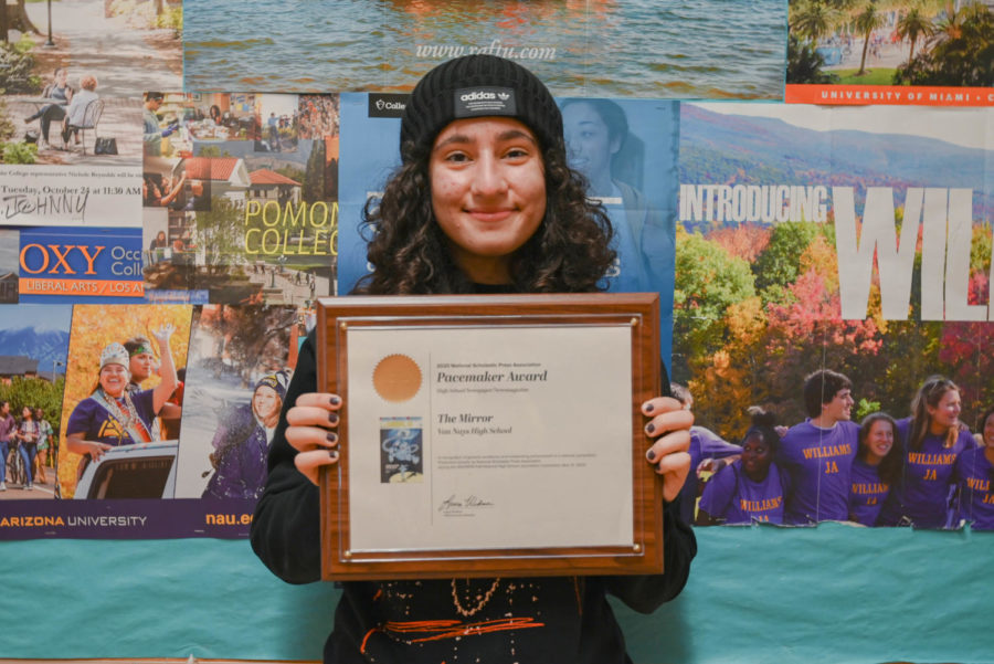 Editor-in-Chief Ani Tutunjyan poses with the Pacemaker award won during the previous year. 