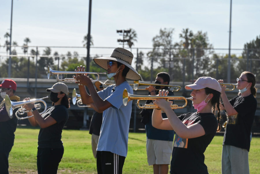 Anthony+Sanchez+and+Mary+Dermenjyan+play+the+national+anthem+as+part+of+the+brass+section.+