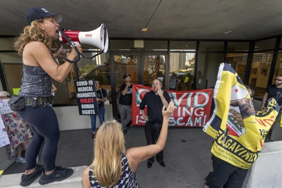 Anti-vaxxers protest against vaccine mandates outside of LAUSDs main offices in Los Angeles. 