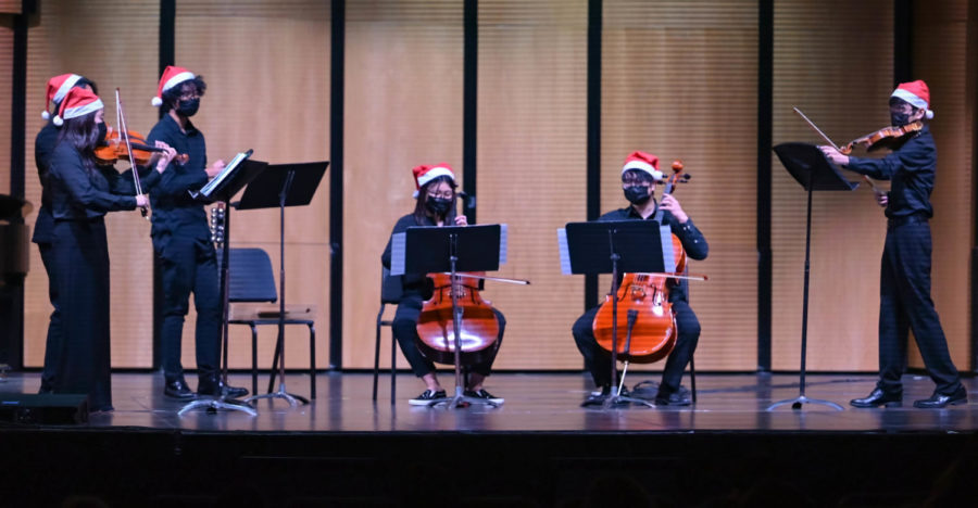 (from left to right) Ensemble lead Rachel Sang, Jayden Juse, Luke Chey, Irene Jeong, Joshua Chung, and Brian Sang perform three Holiday Songs titled “Sleigh Ride,” “Joy to the World” and “Jingle Bells Hoedown,” after intermission. 