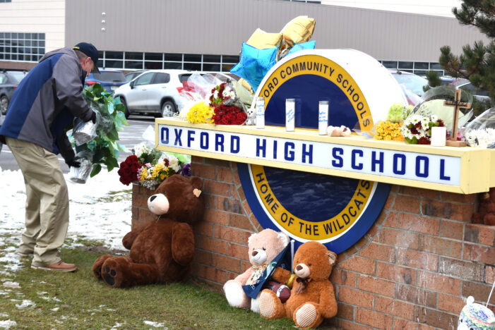 After the tragic shooting at Oxford High School in Michigan on Nov. 30, a memorial with flowers and teddy bears has been set up at the schools entrance in honor of the victims. 