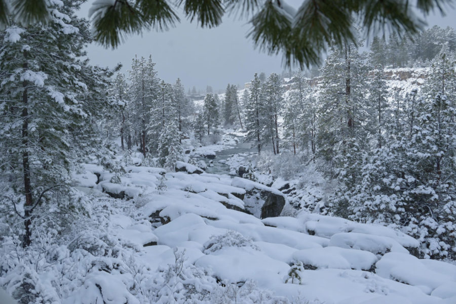 The Deschutes River is covered in white as the new year brings snow to Bend. 