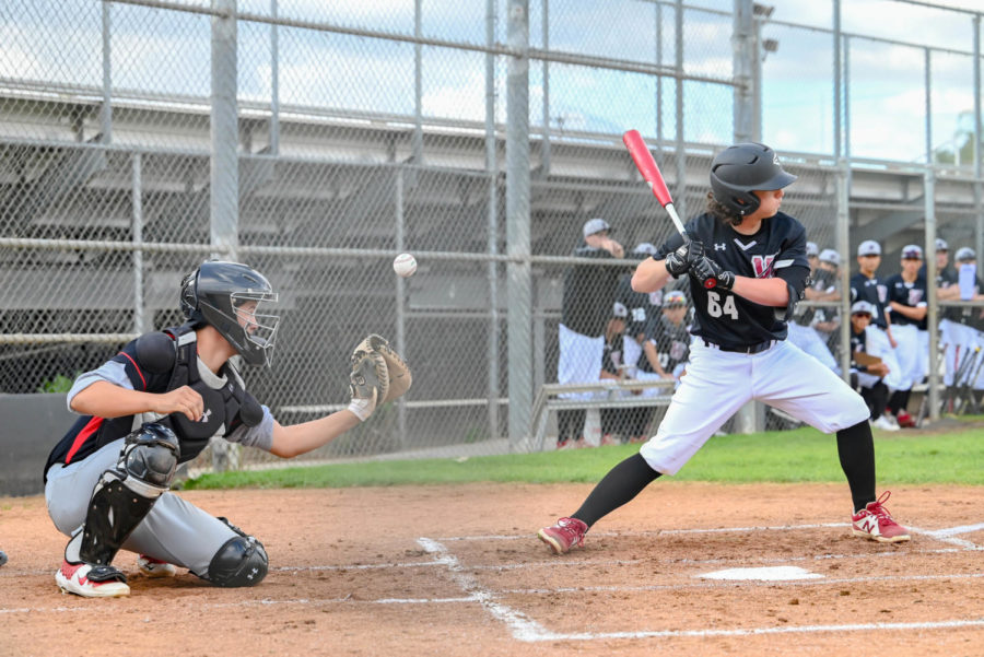 STRIKE TWO: Maximilian Fiore (#64) decides not to swing at a fair pitch in the third inning of the preseason game against Arleta, as the Mustang’s catcher, Michael Bonilla (#15), reaches to snag the ball. Fiore struck out, but the team went on to clobber the Mustangs 16-5 at home on March 4.