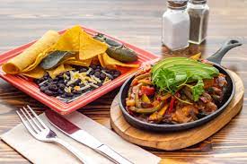 Chicken strips, red & green bell peppers, onions and avocado served with corn tortillas.