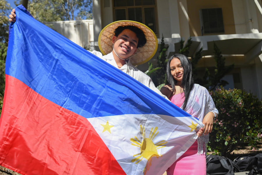  Students such as Seniors Gideon Genesis Dela Torre (left) and Maradie Sattra brought their national flags or wore traditional clothes to school on Multicultural Day to express their national pride. Even students not explicitly working a club stand expressed their cultural and national pride or supported other cultures by walking around with cultural items or flags.