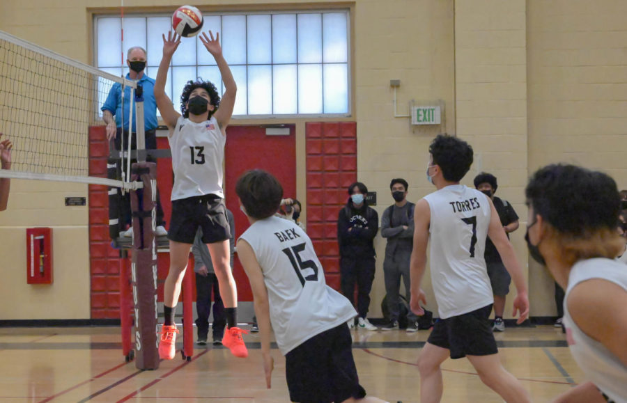 Nieco Erasmo (#13) sets up the ball for his hitters to attack. 