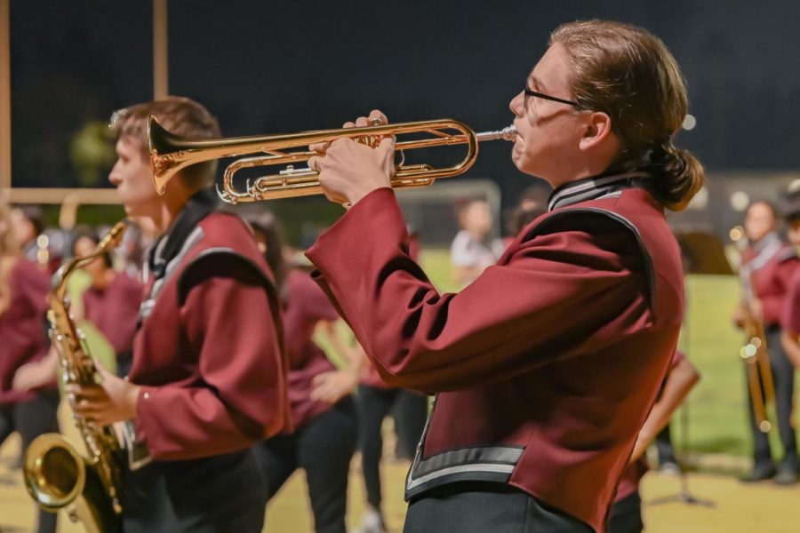 Marching band makes its first appearance at the game, supporting and playing their pop tunes for the team. Senior Miles Haloran plays a passionate solo for the games half-time show with the marching band. 