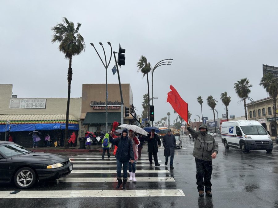 At the green light, staff members use this opportunity as a way to wave their red banners to increase support for the strike.