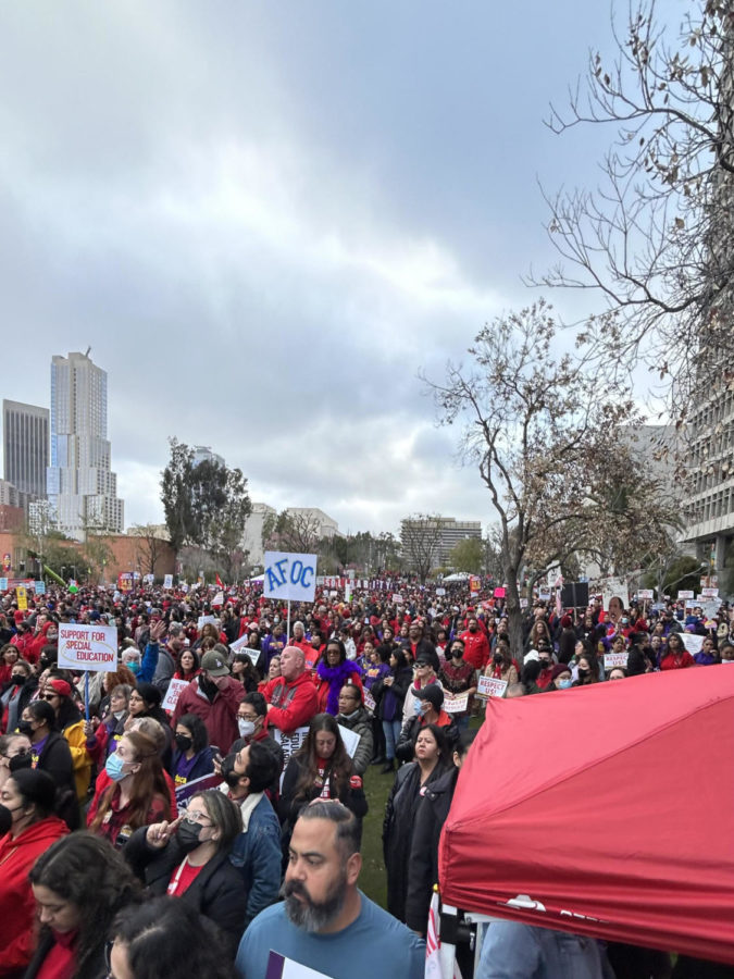 Teachers and school workers rally to protest for better wages.
