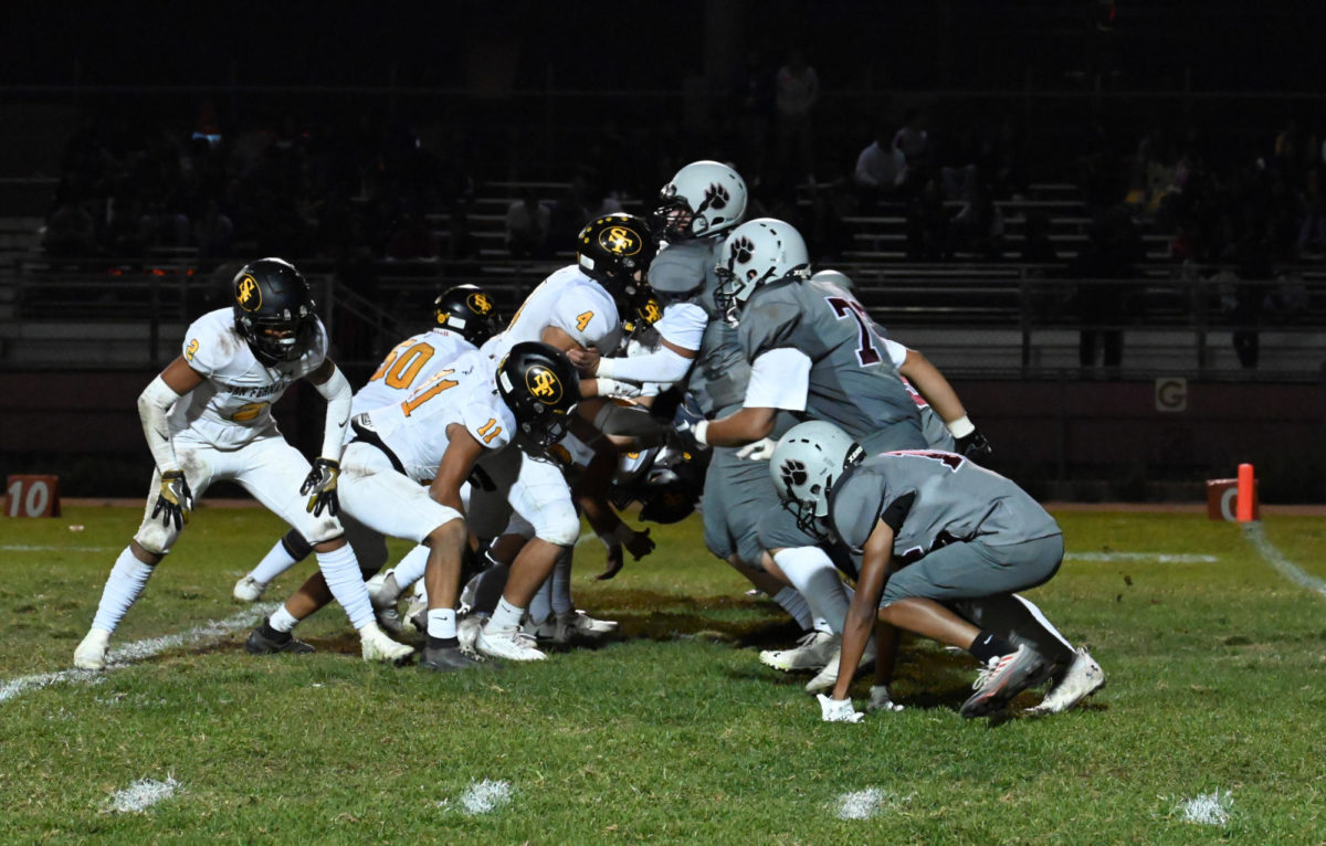Van Nuys clashes with San Fernando at the snap of the football.