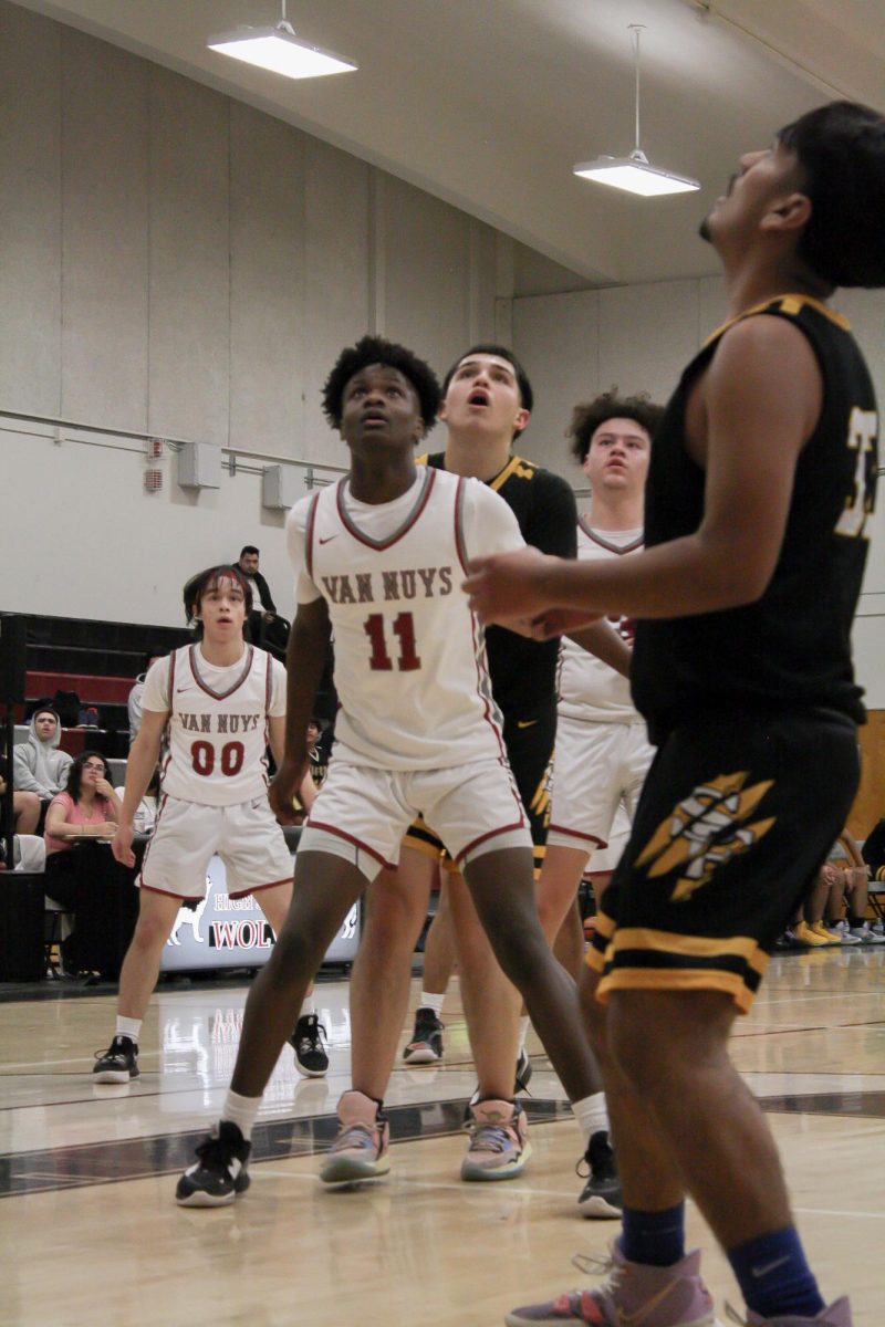 Senior Jonathan Pritchett (#11) was successfully able to box-out his defender to get more offensive rebounds, which gave the Wolves multiple opportunities to score.