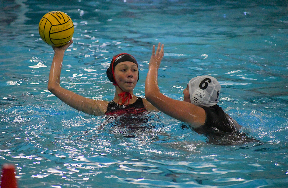 Player Sinai Barajas attempts to block the El Camino Reals shot at scoring another point. In the match on Jan. 10, the girls beat the Royals 8-7.