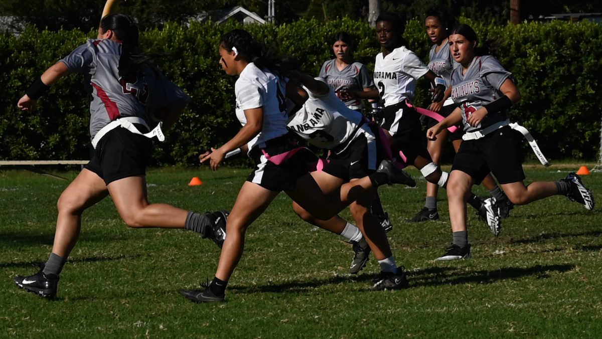GAME DAY The girls flag football team makes a play against Panorama High, winning the game 14-7.