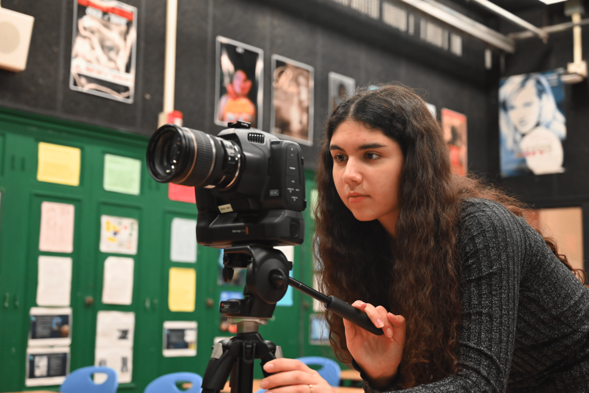 Video production student Anna Khondkaryan prepares her film camera, which she used to film her project Exit the Void.