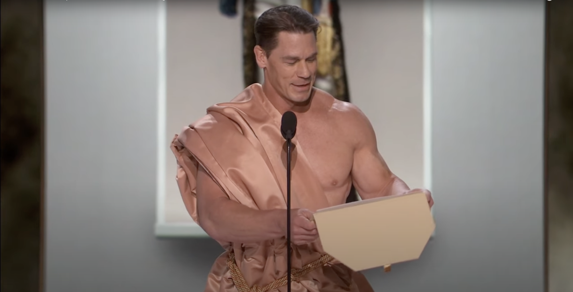John Cena walked out onstage naked before donning a toga to present the award for Best in Costume Design.