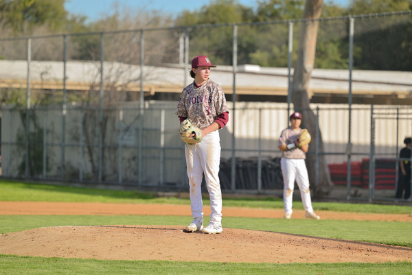 Wolves pitcher Joel Enciso (#3) prepares to pitch to the opposing team.