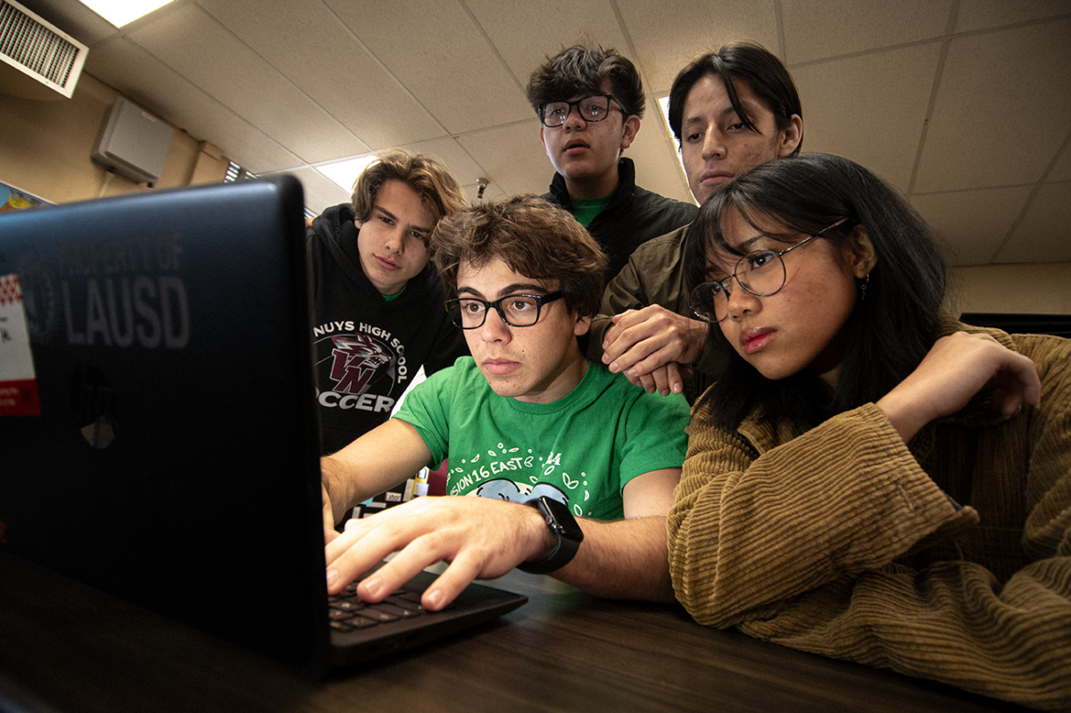 A HISTORIC WIN  (L to R) William Schnider, Hudson Mirsky, Kaela Longboy, Andre Ruiz and David Lara work on their project for National History Day. they won first place at the regional competition with their documentary film Americas Dissonant Harmonies and are advancing to the State Competition.