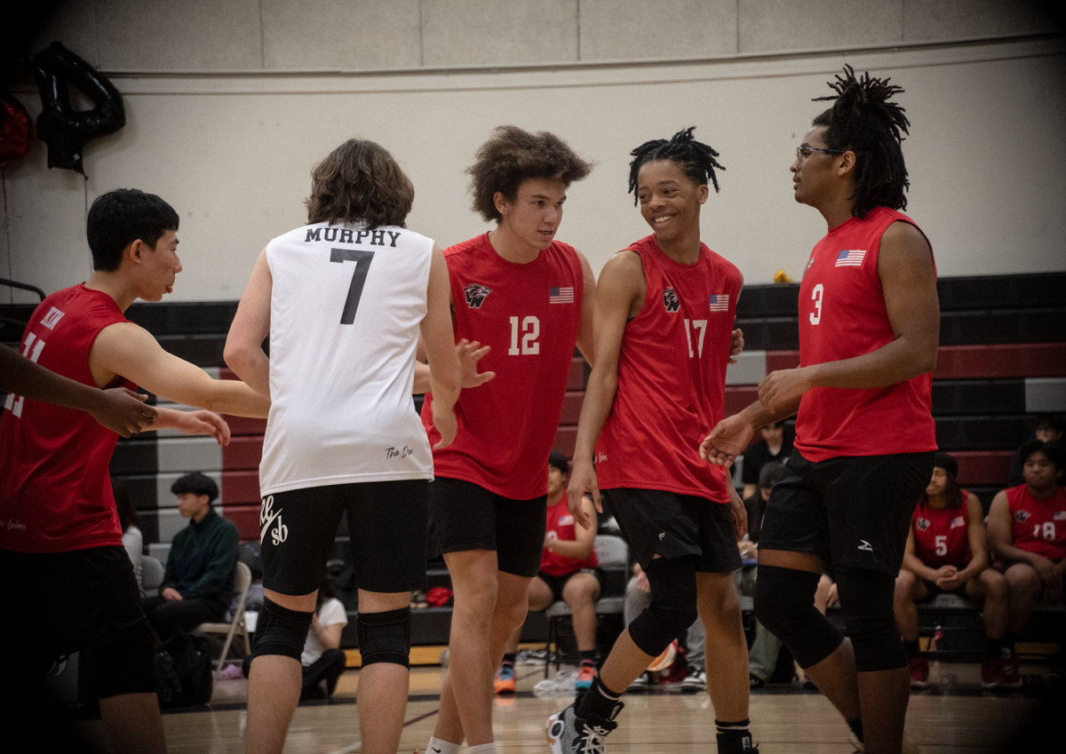 From L to R: Jonathan Kim, Joshua Murphy, Lucca Riley, Aidyn Kinchen and Devin Brown huddle together and quickly talk strategy after scoring a point.
