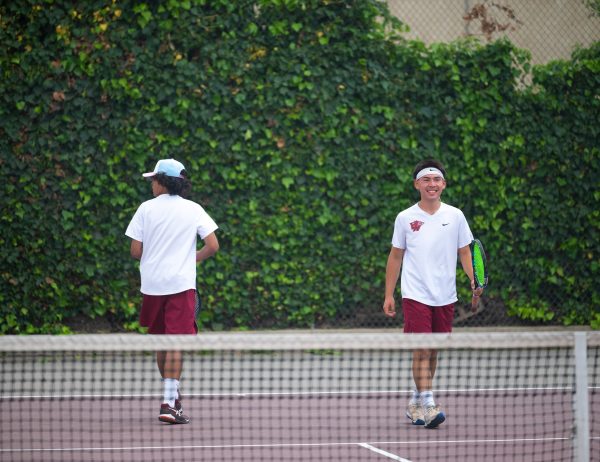Senior Team Captain Kirk Uytiepo and freshman Cliff Favis giving it their all and having fun despite facing their most challenging opponents that day.