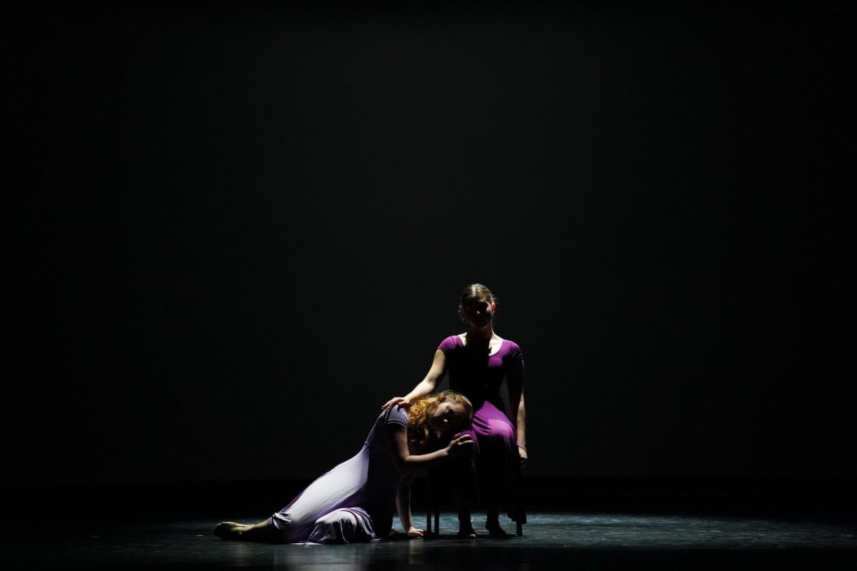 n a touching piece performed by Ms. Partida's advanced dancers to the song "I Miss Her" by Jessie J, juniors Brianna Schneider and Penny Epstine dance as Ms. Partida and her mother. (Lighting Design: Ethan Rodda)