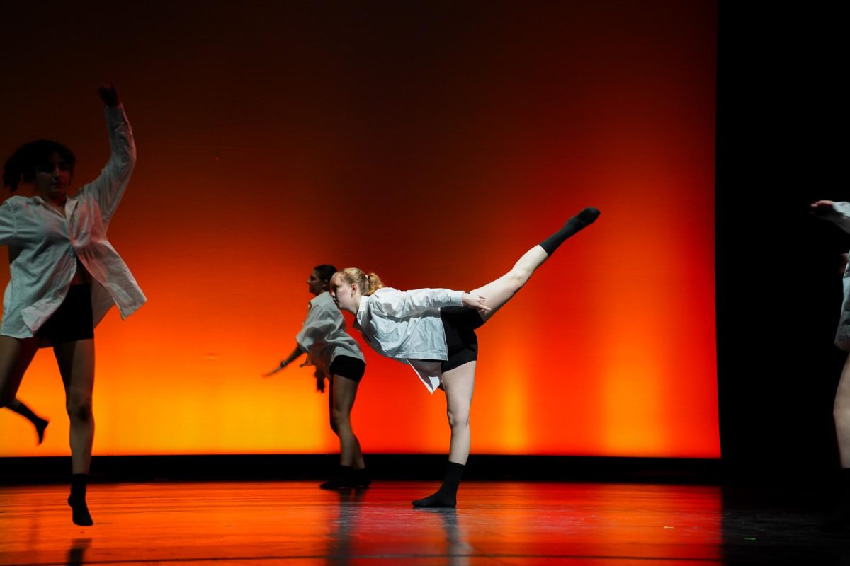 Junior Brianna Schneider performs with Ms. Partida's second period advanced dance class. (Lighting design: Ethan Rodda)