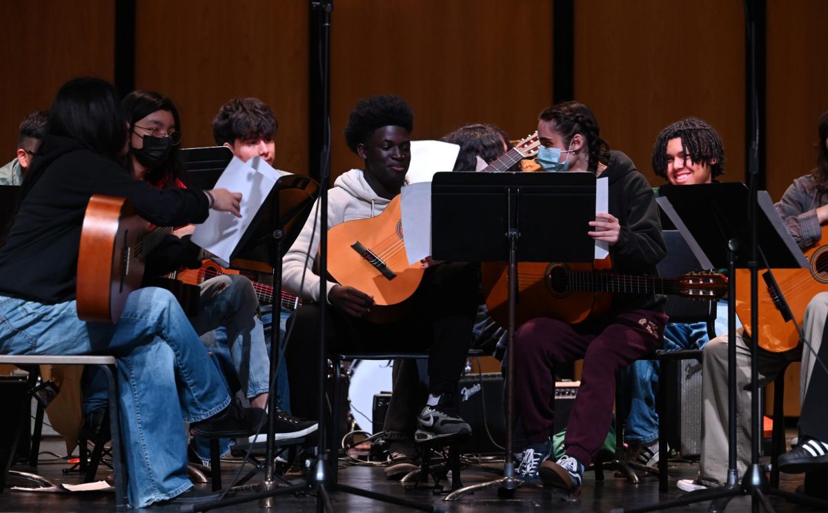 The students in Ms. Bellusci’s guitar class perform a couple songs for Tom Morello.
