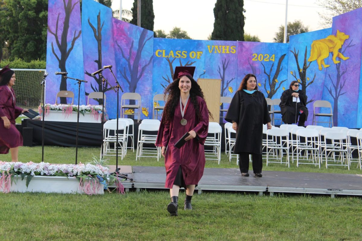 After shaking hands with principle Mrs. De Santiago, graduate Anna Khondkaryan steps off the stage and heads back to the crowd of students.