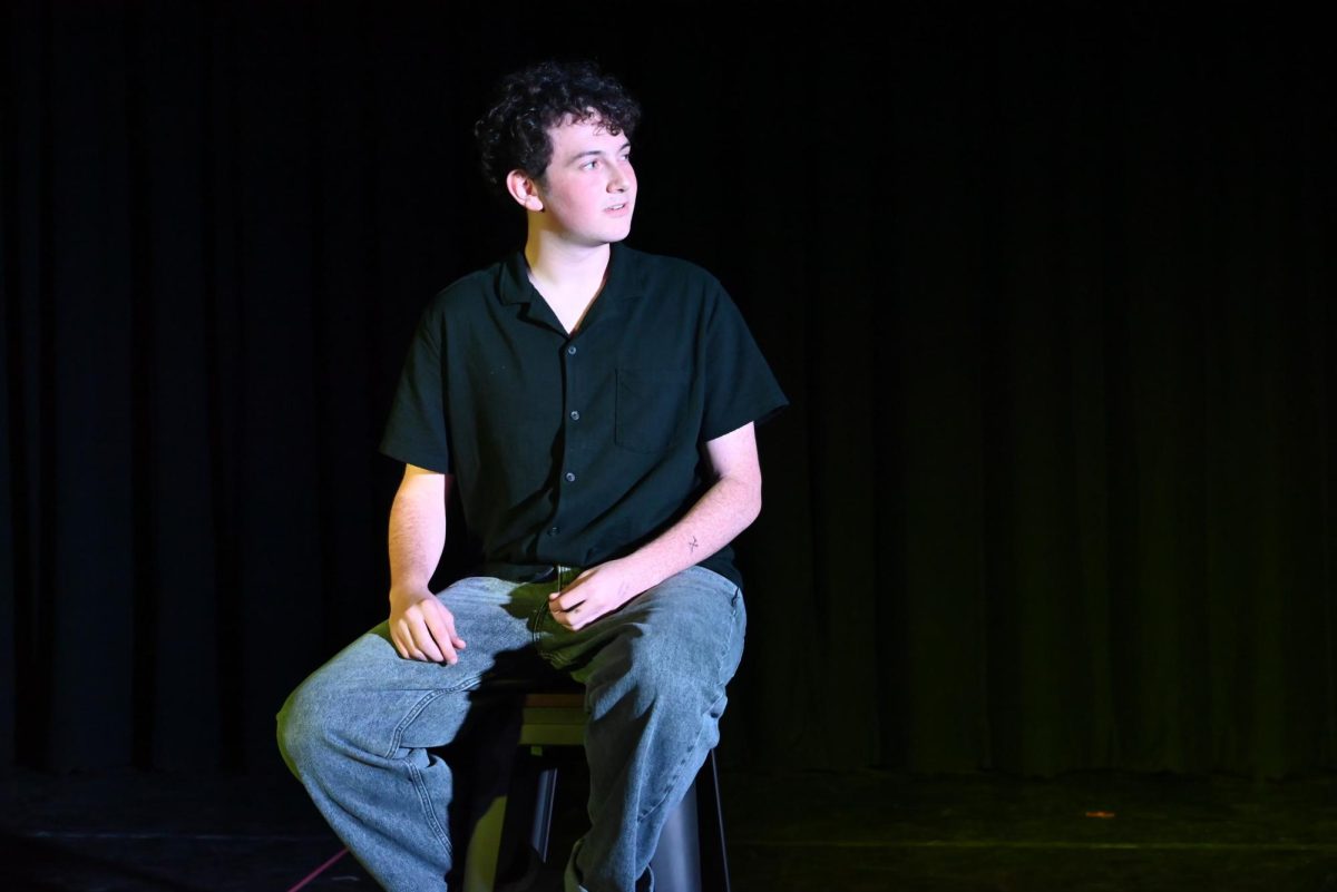 Senior Julian Pankowki glances to his duet partner, Emily Chavez, during their performance of "Once".