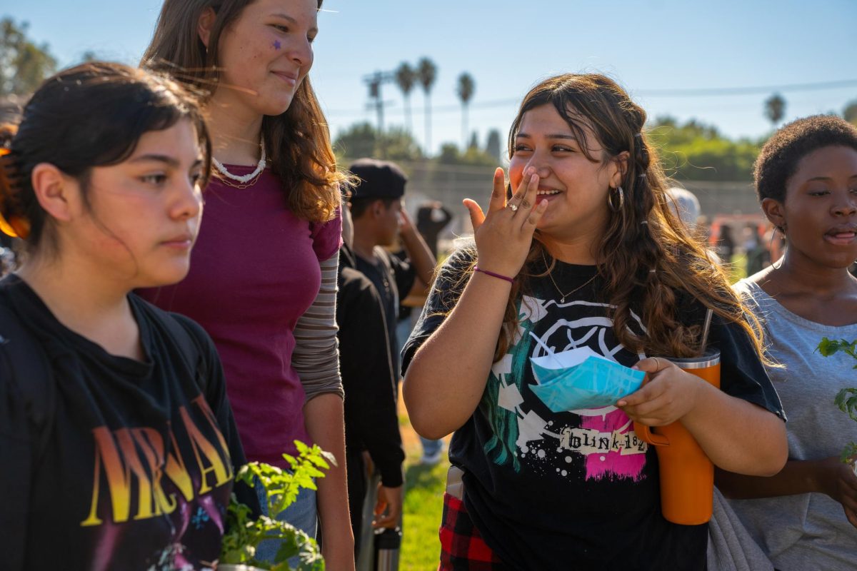 Cheer and laughter fills the crowd as students gather around to get their share of ice cream and churros, during Freshman Funday. 