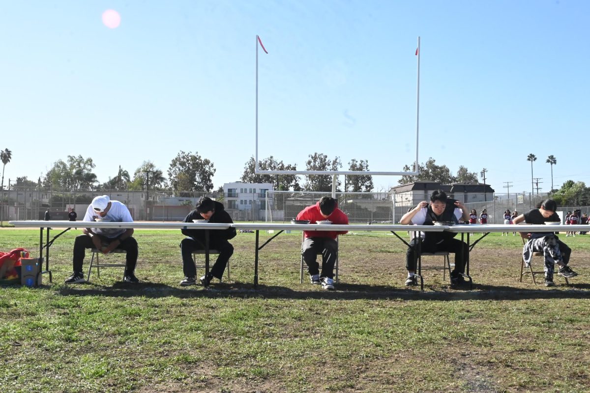 Students of each grade as well as sports coach, Mr. So, begin chowing down on pies, competing to see who can eat it the quickest without using their hands.