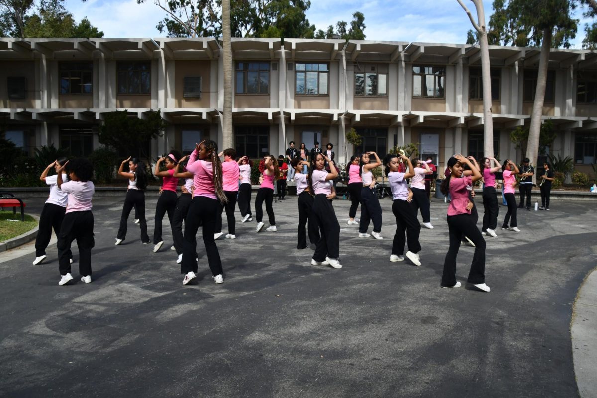 PASSION IN PINK | The Dance Company performs a hip-hop routine at the pep rally, going all-out with their movements. The dance was student-choreographed by Senior Ocean Threats, Senior Jurnee Joseph, Senior Danica Manarang, Senior Luanna Melgar-Benitex, and Freshman Anaya Loox. 