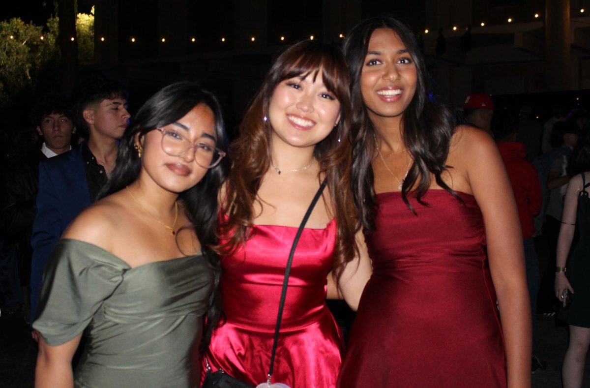 (From L to R) Seniors Sharlene Kaur, Olivia Yoshizaki and Arya Shah show off their stylish, silky dresses at the dance.
Kaur states, "Everything about it was amazing and I really enjoyed it in the end."