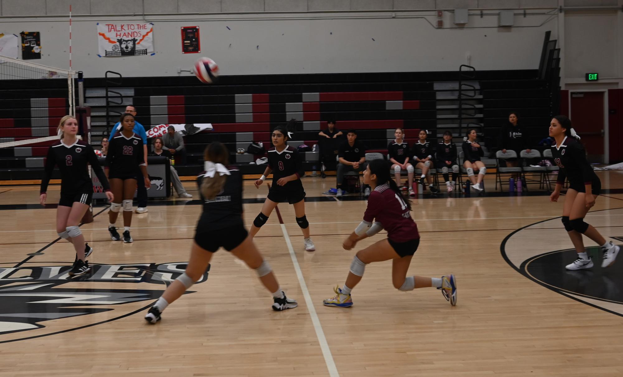 Team captain Samanta Sirichai and Libero Camila Santiago reach to receive the ball and continue their win streak.