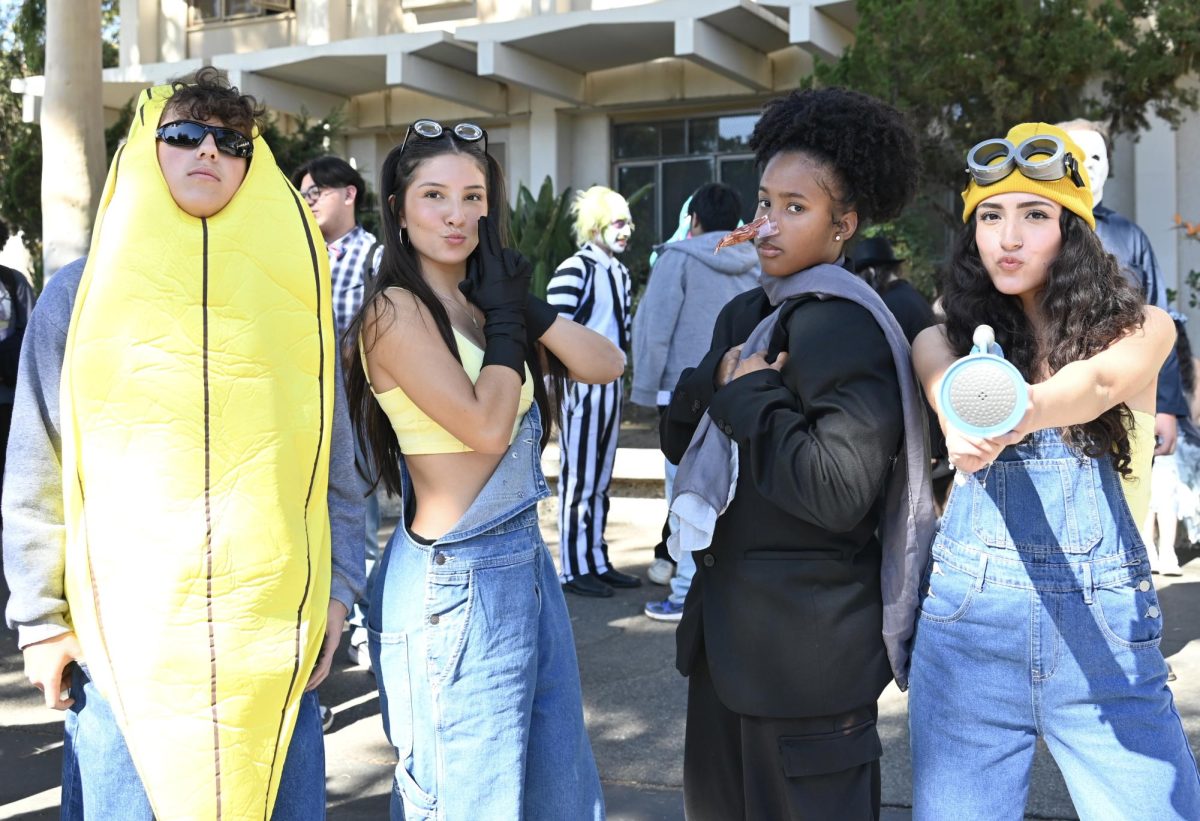 (L-R) Students Damian Ortiz, Luana Melgar-Benitez, Jurnee Joseph, and Sam Dorado come together to celebrate winning best group costume after dressing up as Gru and His minions. 