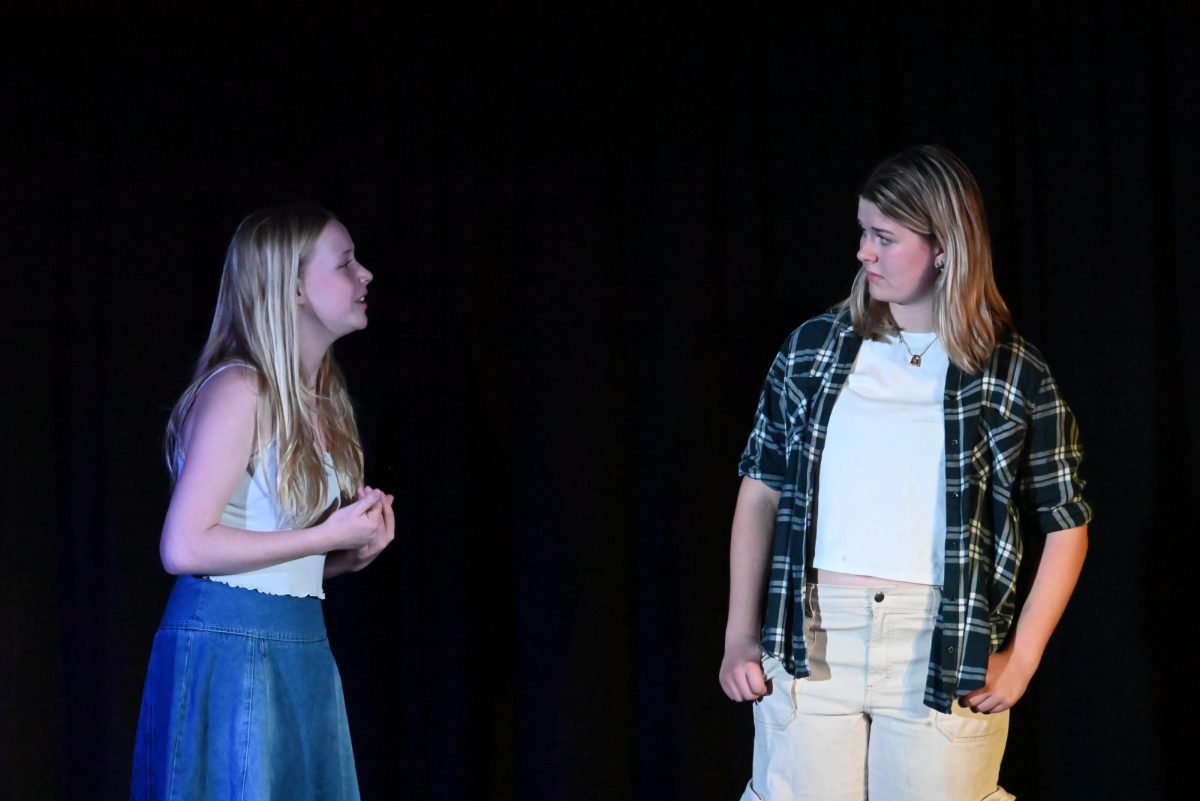 (From L to R) Sophomore Ellie Steinberg and Amelia Probst sing their rendition of "Throwing in the Towel" from "Outsiders" the musical