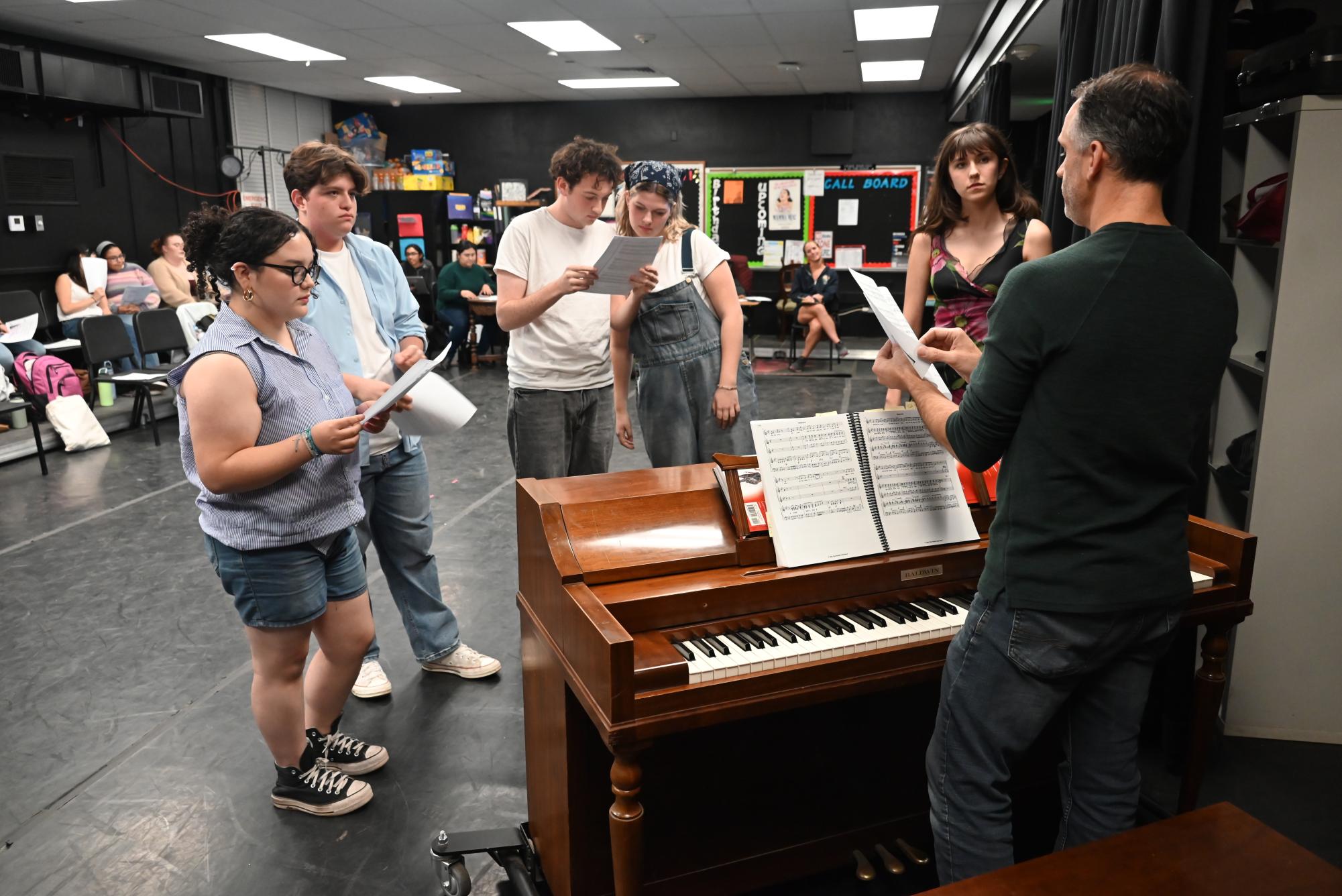 The groups up for the roles of Pepper and Tanya learn the song "Does Your Mother Know" with Director Mr. Justin Baldridge.