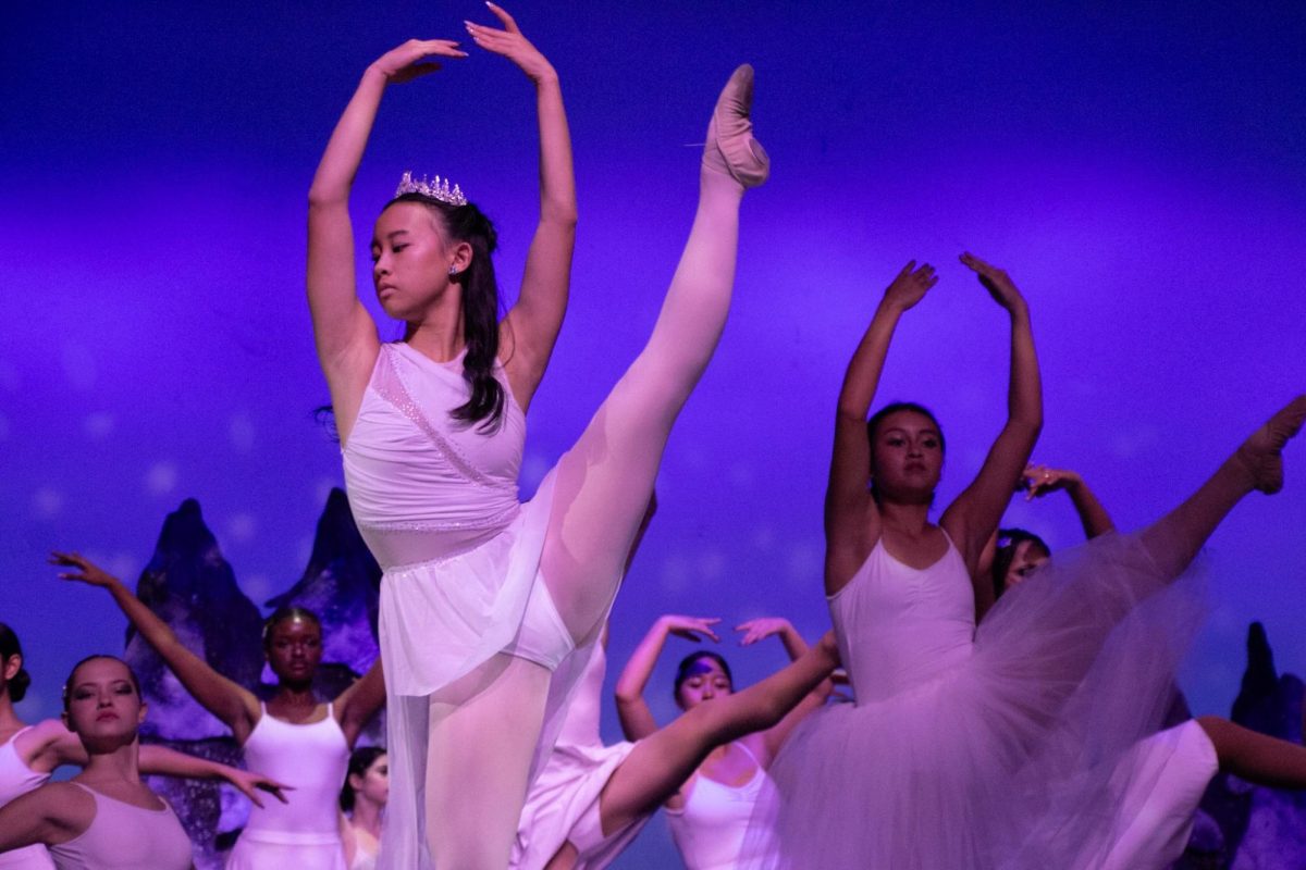 Junior Summer Chu, accompanied by Dance Company work together to perform the entrance of the White Witch